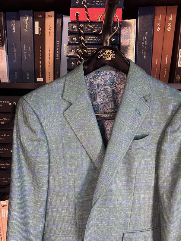 Sea green sport coat with a lavender windowpane and a paisley lining